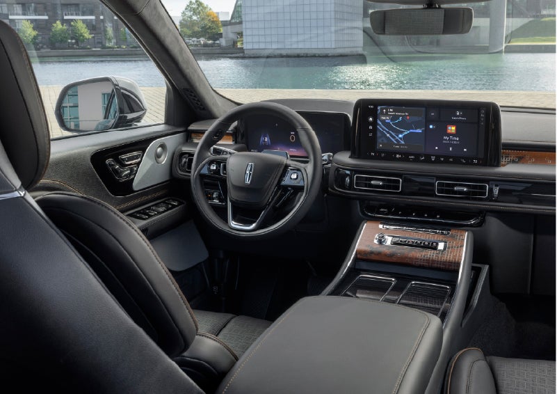 The interior of the 2026 Lincoln Aviator® SUV is shown parked with a view of a harbor through the windshield. | Stuteville Lincoln of Ponca City in Ponca City OK